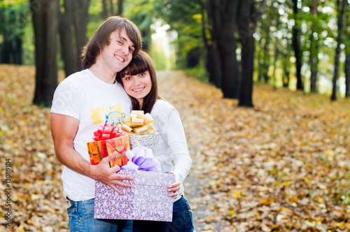 Young couple with gift boxes