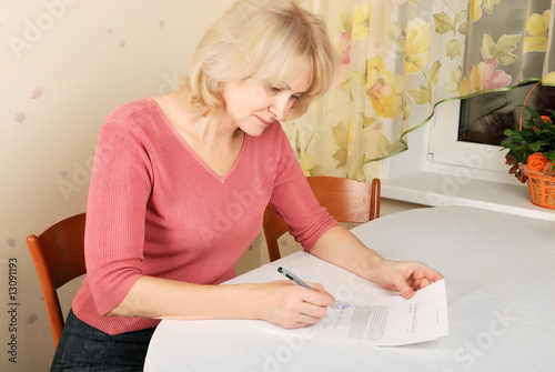 Adult blond woman with document