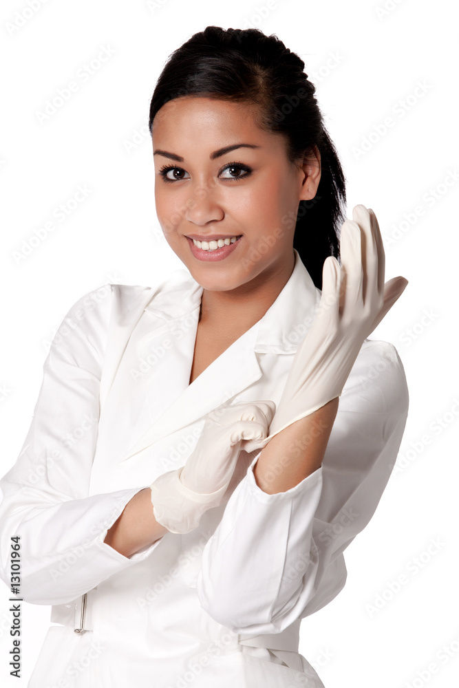 Portrait of a beautifull Indonesian nurse putting gloves on Portrait of a beautifull Indonesian nurse putting gloves on