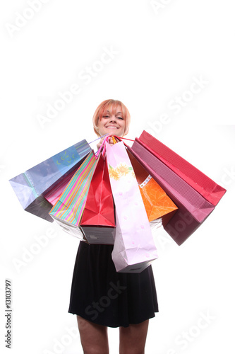 happy young girl with colored bags