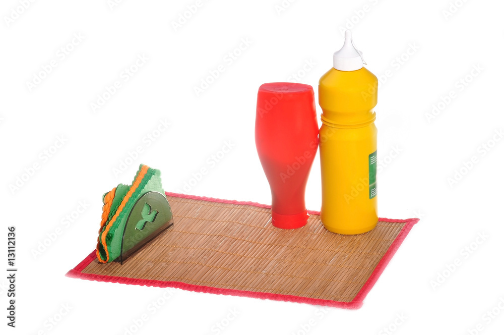 Preparation to meal - mustard and ketchup on mat
