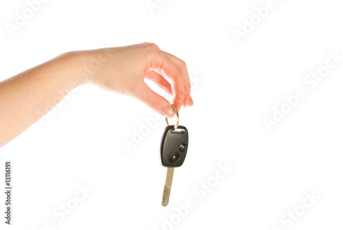 Hand giving a key isolated on white background