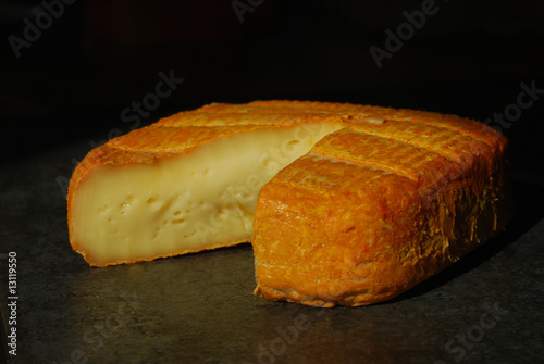 An orange rinded French Rouy soft cheese from Bourgogne photo