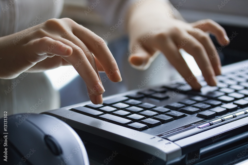 Female hands on the black keyboard. Female hands on the black keyboard.