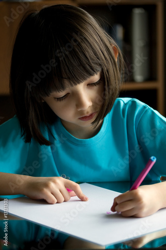 Child draws.