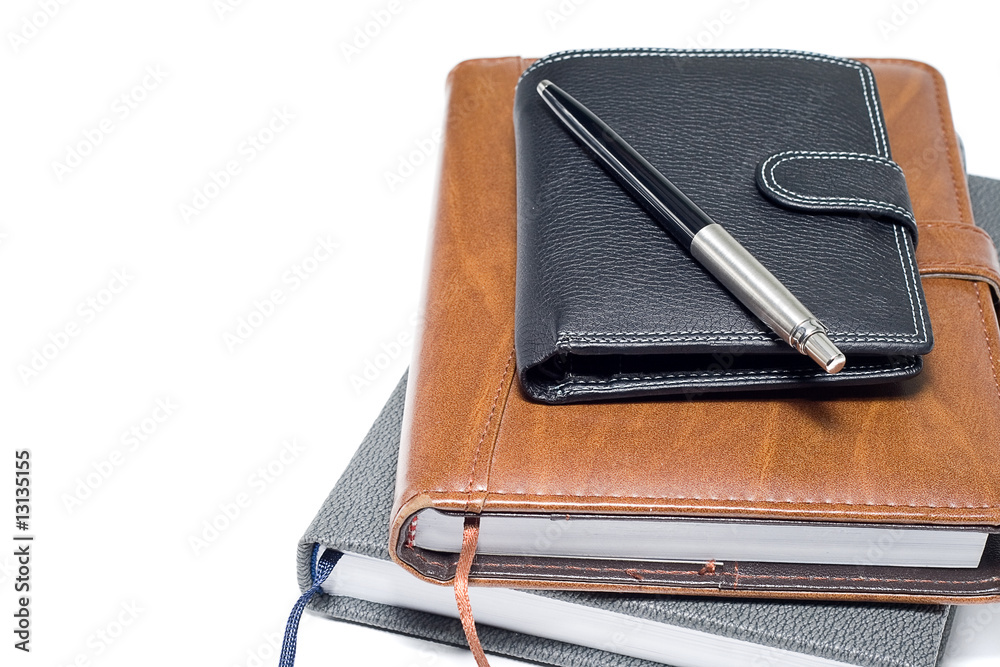notebooks with wallet and pen isolated on a white notebooks with wallet and pen isolated on a white