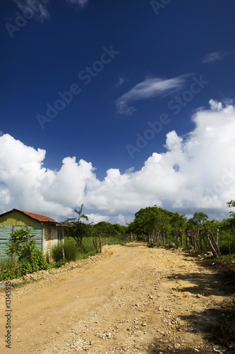 Unmade earth road in a village Dominican republic