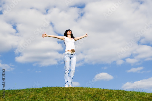 happy young woman dreams to fly on winds