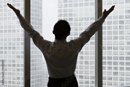 businessman celebrates success after working overnight
