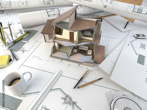 architect drawing table with section model