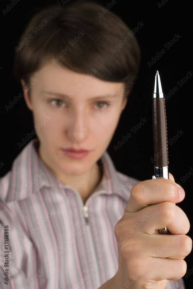 Young girl holding roller pen on black Young girl holding roller pen on black