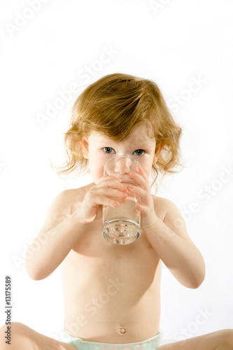 Cute child drinks water