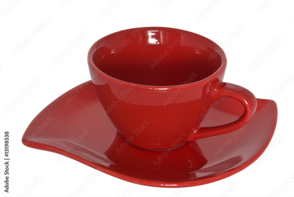 Red cup and saucer. Close-up. Selection path. Red cup and saucer. Close-up. Selection path.