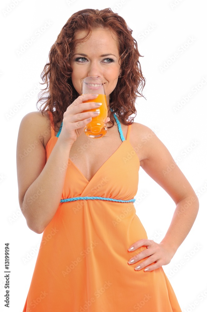 Beautiful young woman drinking orange juice