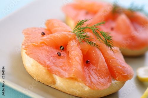 Smoked salmon on bagel with fresh black pepper.
