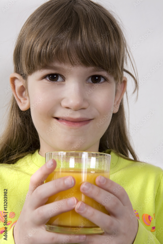 little cute adorable girl seven years old drink orange juice little cute adorable girl seven years old drink orange juice