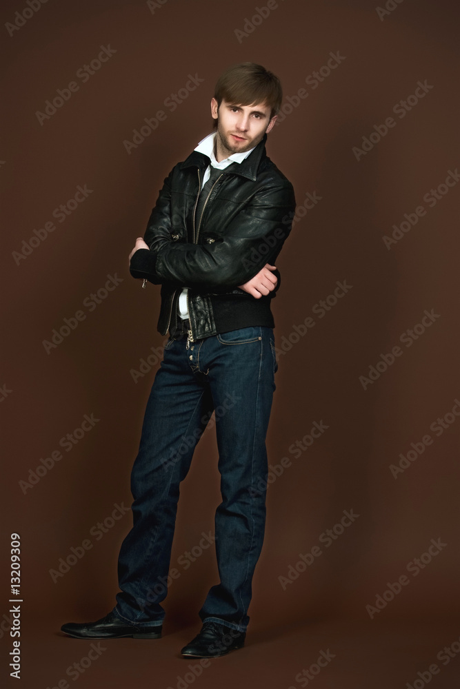 man in leather jacket with crossed hands man in leather jacket with crossed hands