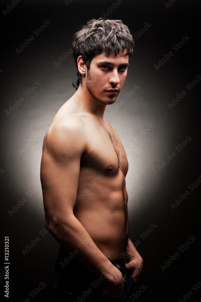 Fototapeta premium handsome young man against dark background