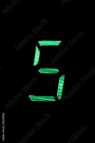 digital number five in green on black background