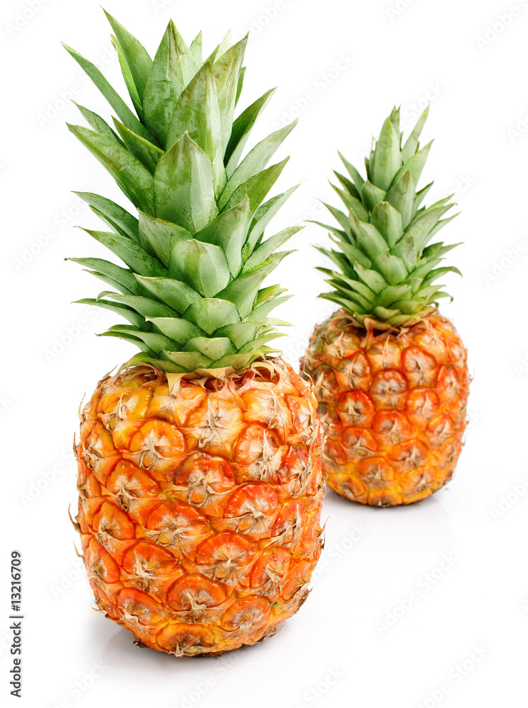 fresh pineapple fruits with cut and green leaves fresh pineapple fruits with cut and green leaves