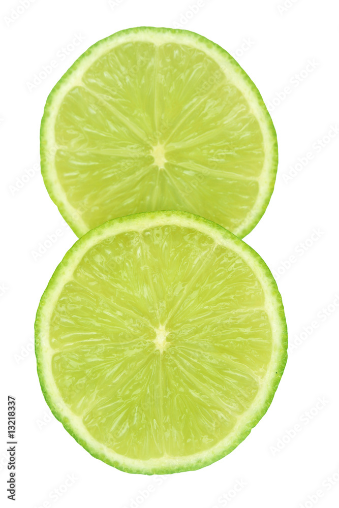 Two slices of lime isolated on white.