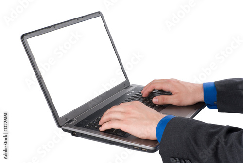 Businessman finger on the laptop's keyboard isolated