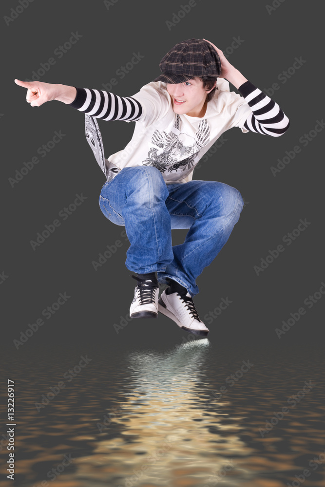 Fototapeta premium Teenage boy jumping and dancing Locking or Hip-hop dance
