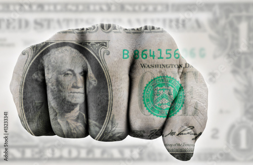 fist with one us dollar