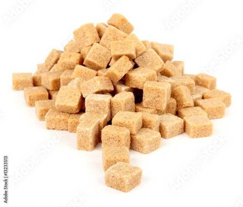 Brown sugar cubes isolated on white