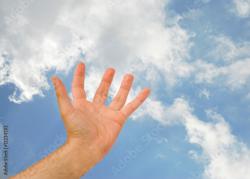 Hand reaching sky