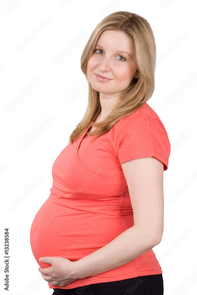 Studio portrait of the pregnant woman in red on a white backgrou Studio portrait of the pregnant woman in red on a white backgrou