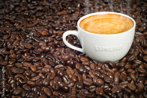 Cup of Morning Espresso in Dark Roasted Coffee Beans