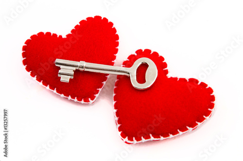 Two hearts and a key to signify security in a relationship.