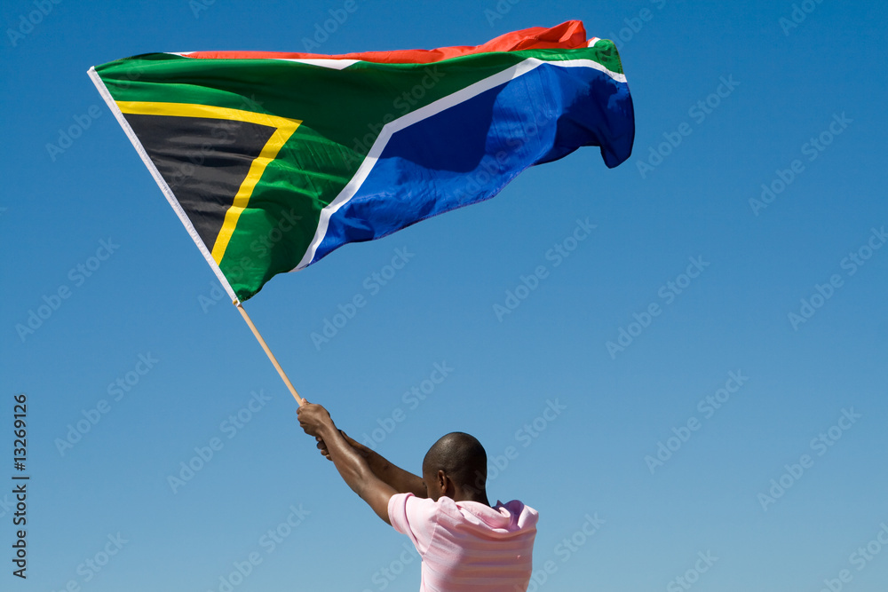 african man waving a south african flag - obrazy, fototapety, plakaty 