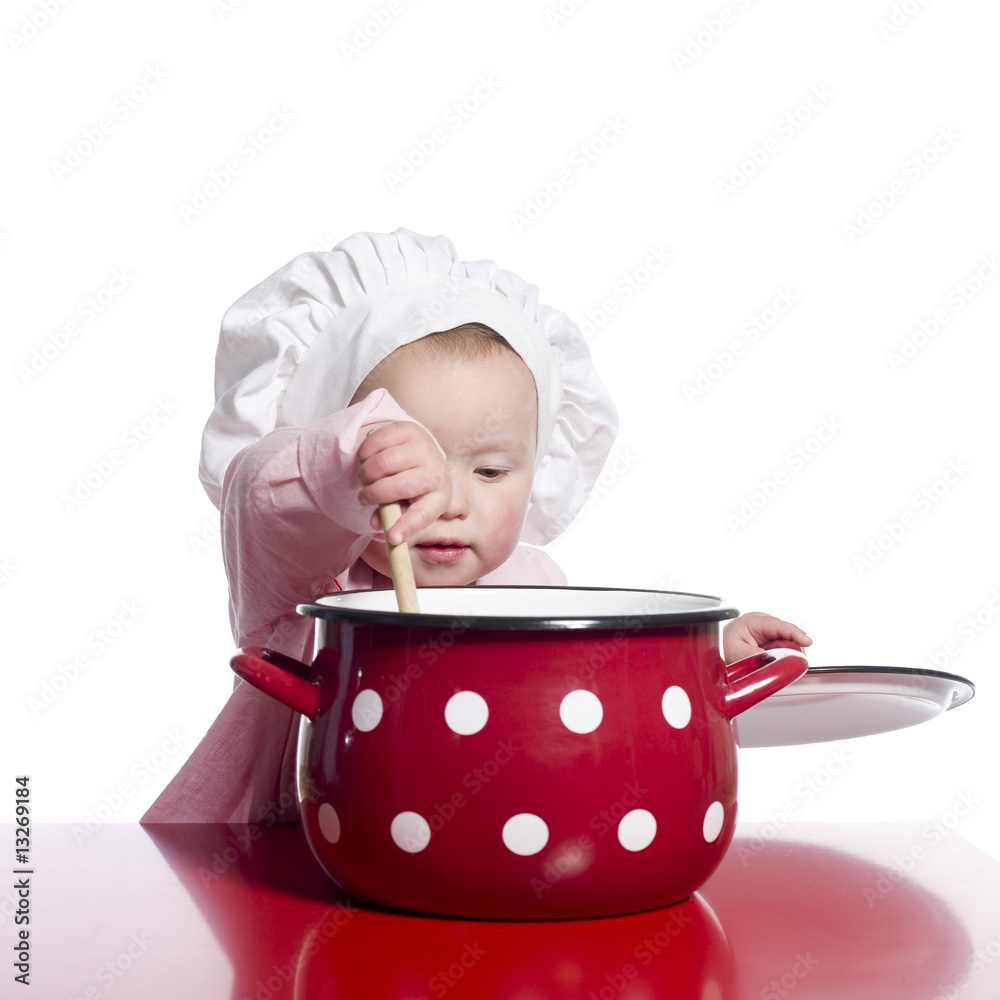 Toddler pretending to cook with a big red pot. Toddler pretending to cook with a big red pot.