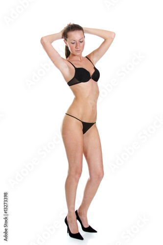 Beautiful underwear model posing on a white background