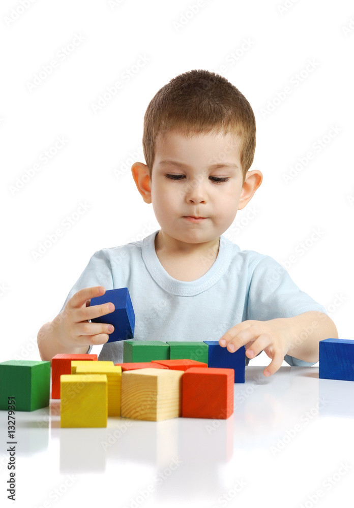 The little boy plays with cubes The little boy plays with cubes