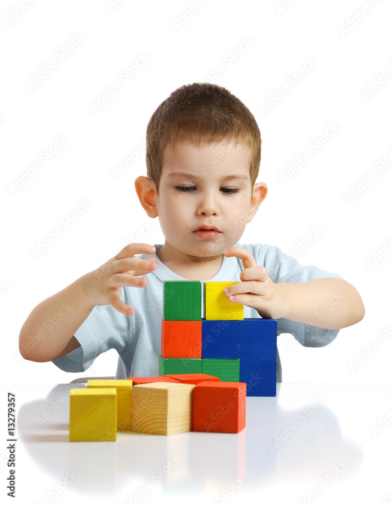 The little boy plays with cubes The little boy plays with cubes