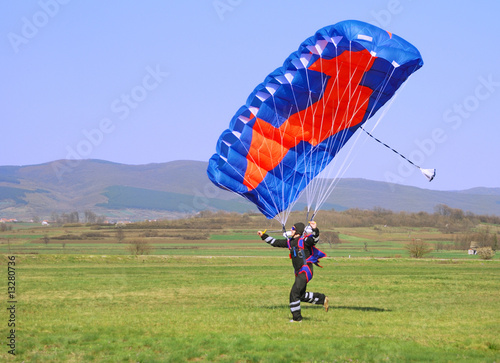 Parachutist running