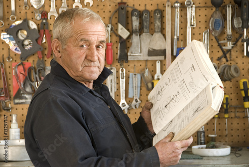 Older Mechanic Reading