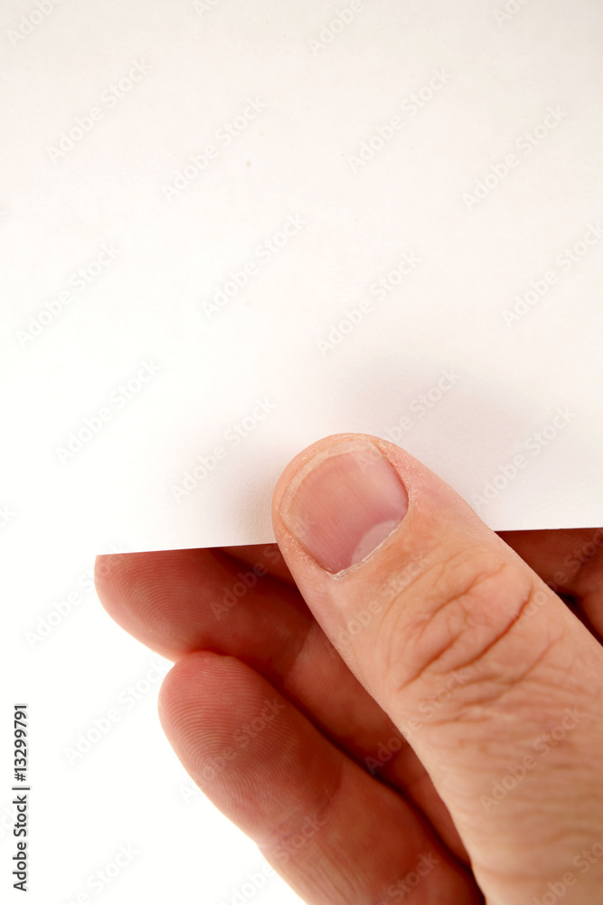 Hand holding blank piece of paper Hand holding blank piece of paper