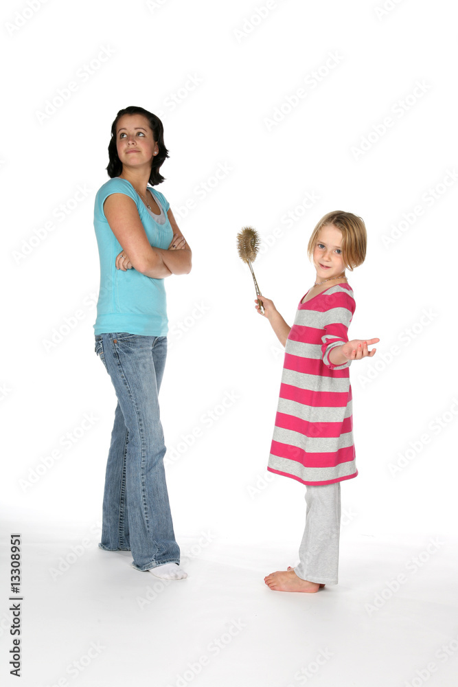 big sister looking away while little sis holds toilet brush big sister looking away while little sis holds toilet brush