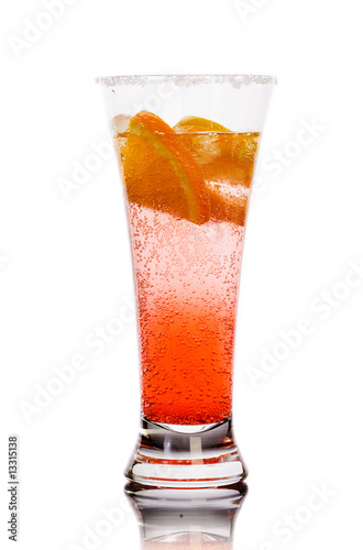 Red drink with ice and lemon isolated over white. Studio.