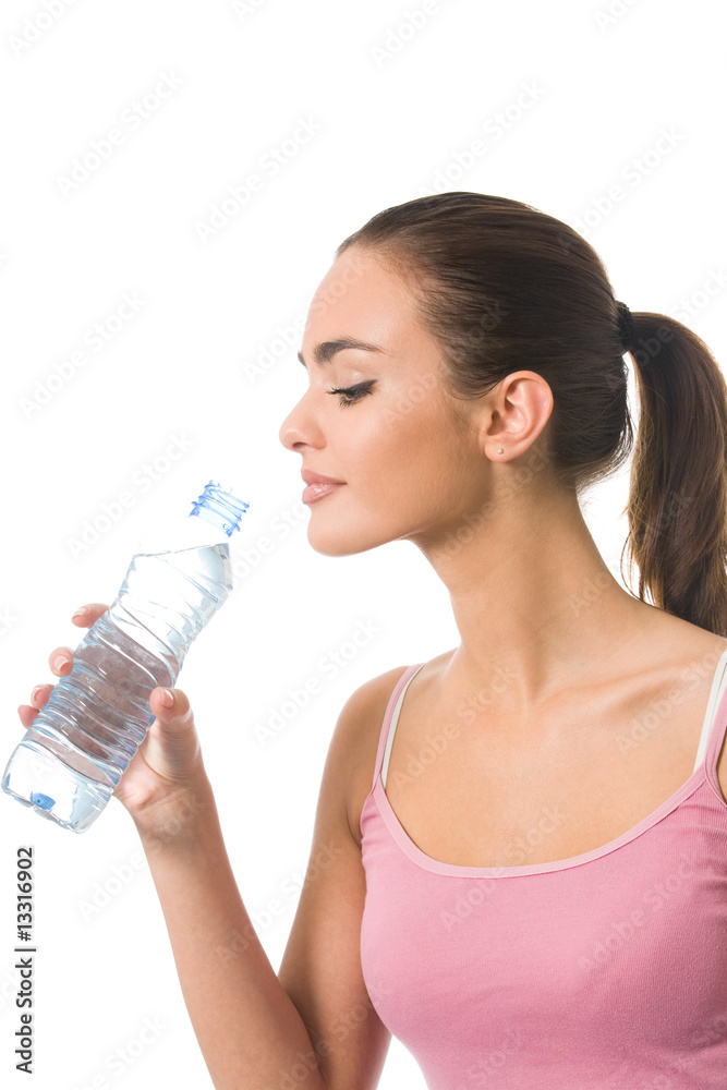 Young happy woman in sportswear with water, isolated Young happy woman in sportswear with water, isolated
