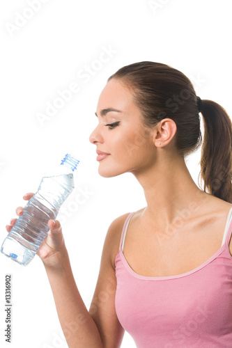 Young happy woman in sportswear with water, isolated