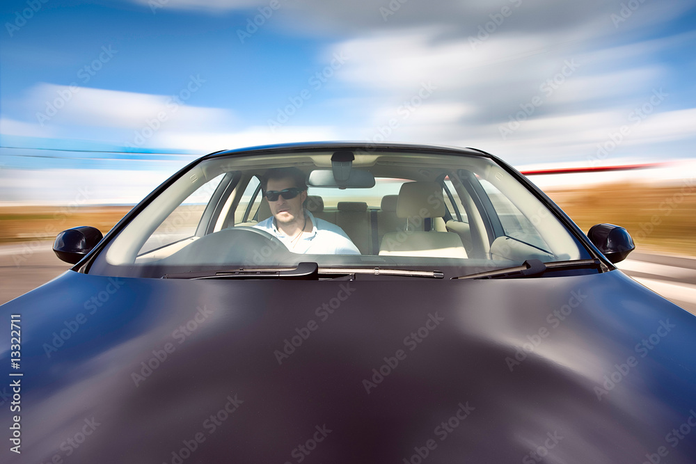 Obraz premium Black Car In Motion