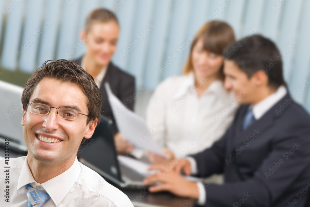 Successful businessman and business team at office Successful businessman and business team at office
