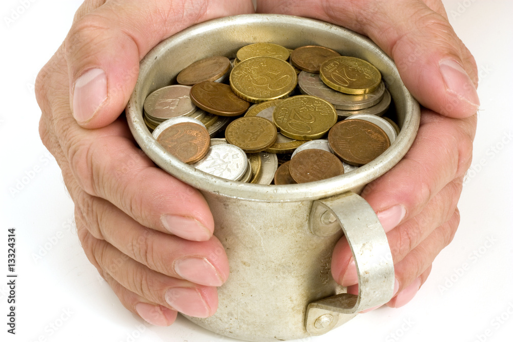 Fototapeta premium The Male hands and aluminum mug with money.