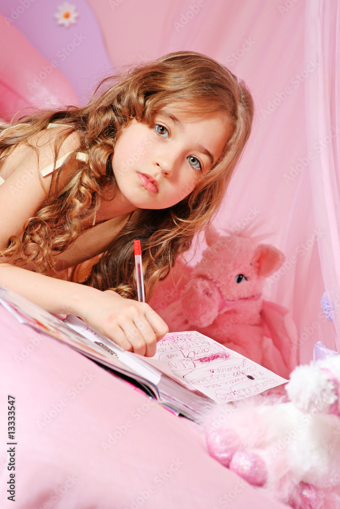 Beautiful little girl writing diary Stock Photo Adobe Stock