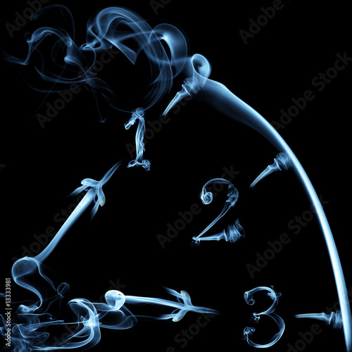 smoky clock on black